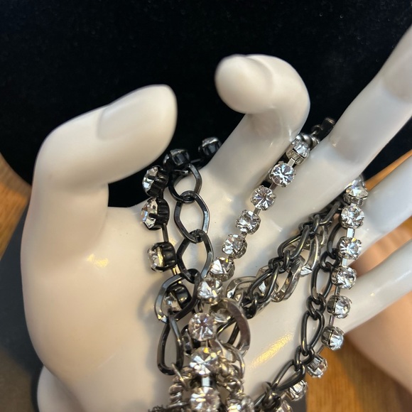 Betsey Johnson Chain/Charm bracelet
Silvertone/black/rhinestones 
Skull Key logo - Picture 6 of 11